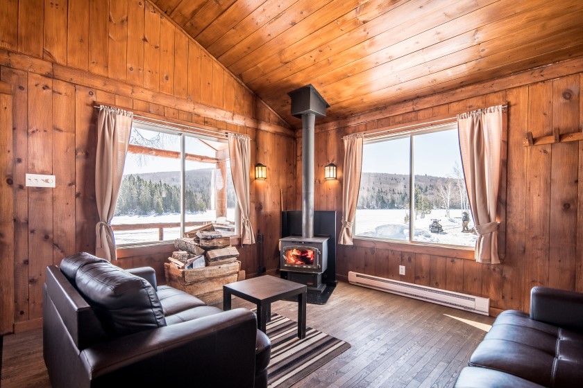 Chalet #1 at Pourvoirie Mekoos. Lounge has a comforting fire